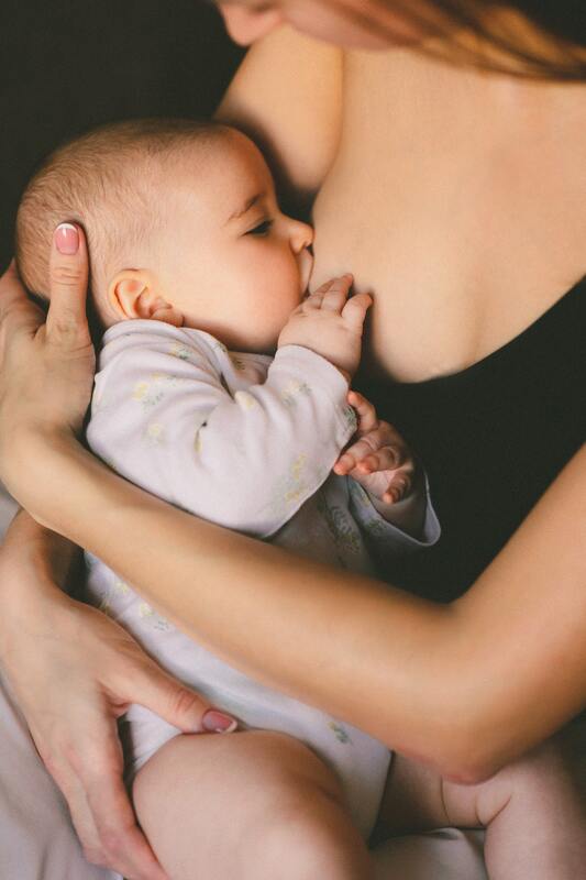 baby nursing at breast